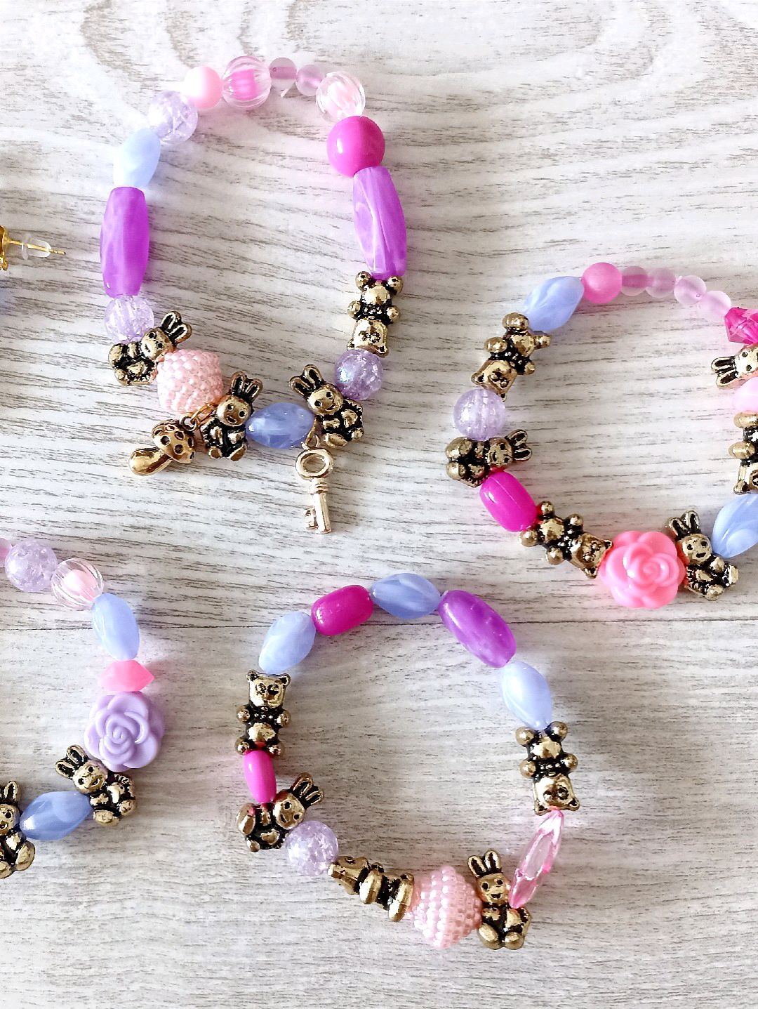 lila-pembe-hayvan-figurlu-bileklik-kupe-set-takim-lila
